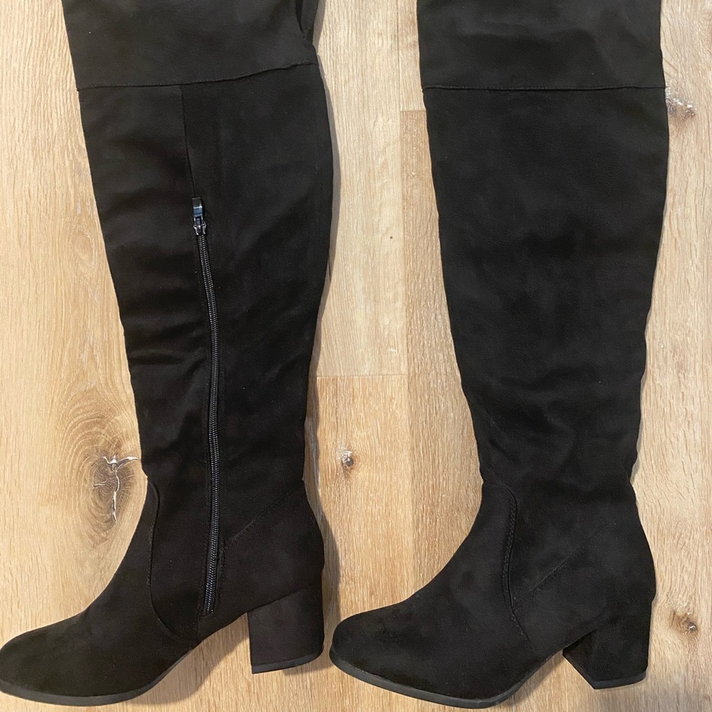 Thigh high boots.
